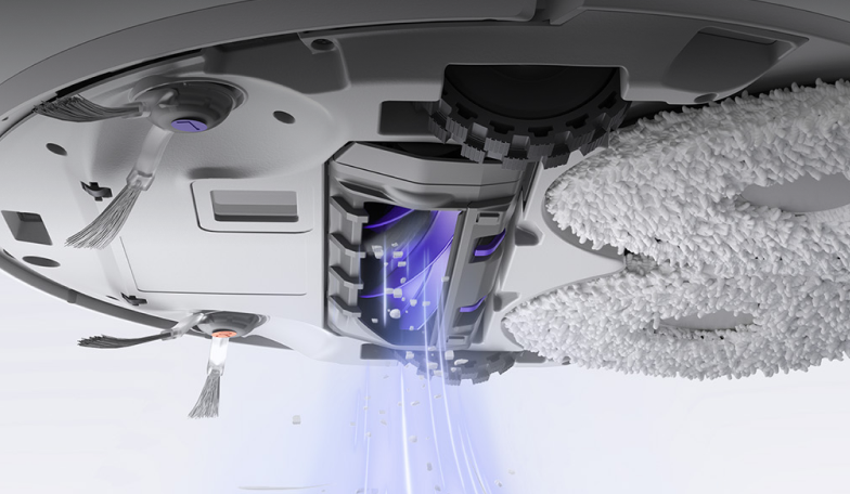 Bottom view of Narwal robot vacuum with cleaning pads in motion.