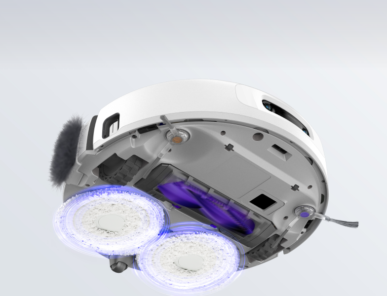 Bottom view of Narwal robot vacuum with cleaning pads in motion.